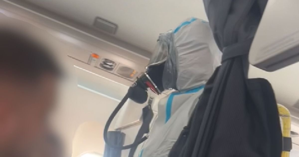 flight pandemonium3a hazmat suit clad firefighters storm british airways plane