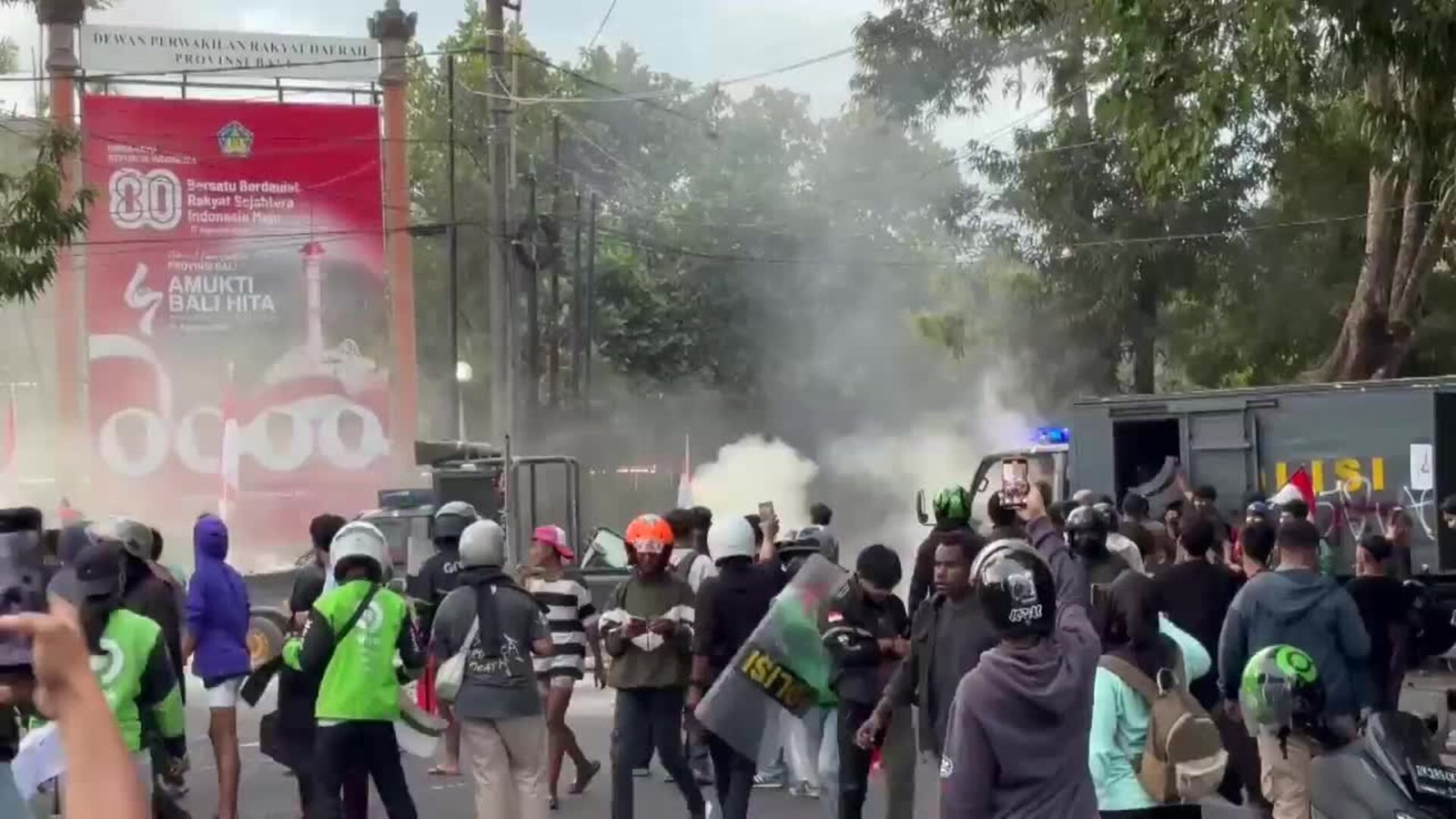 riot police disperses protests in bali with tear gas