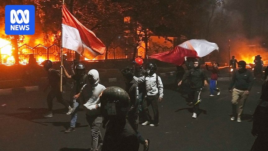 three dead after angry mob sets fire to parliament building in indonesia