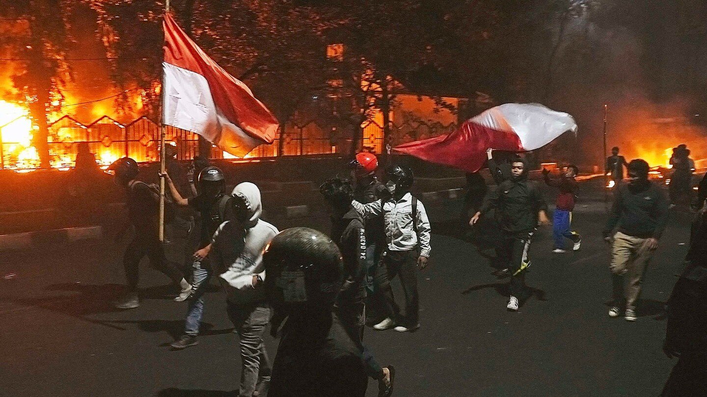 three dead after mob sets fire to indonesian regional parliament building