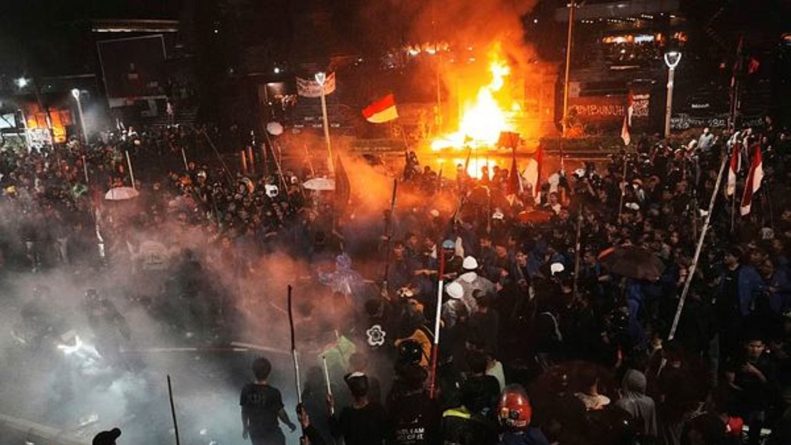 three dead in violent protests at indonesian regional parliament building