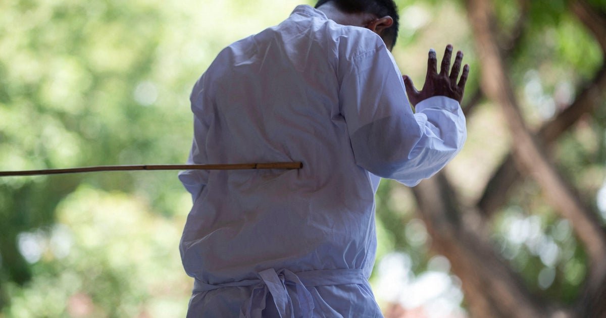 two men publicly caned in indonesia for hugging and kissing