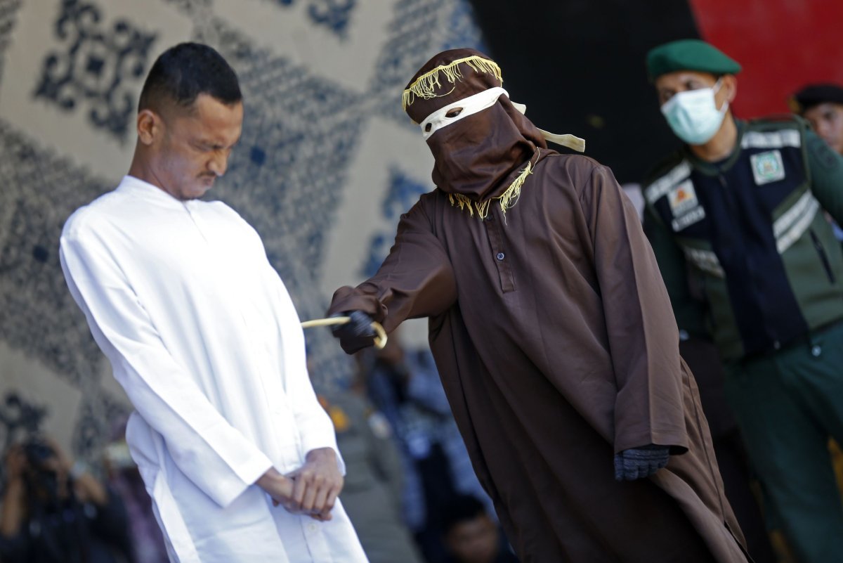 two men publicly caned in indonesia for kissing