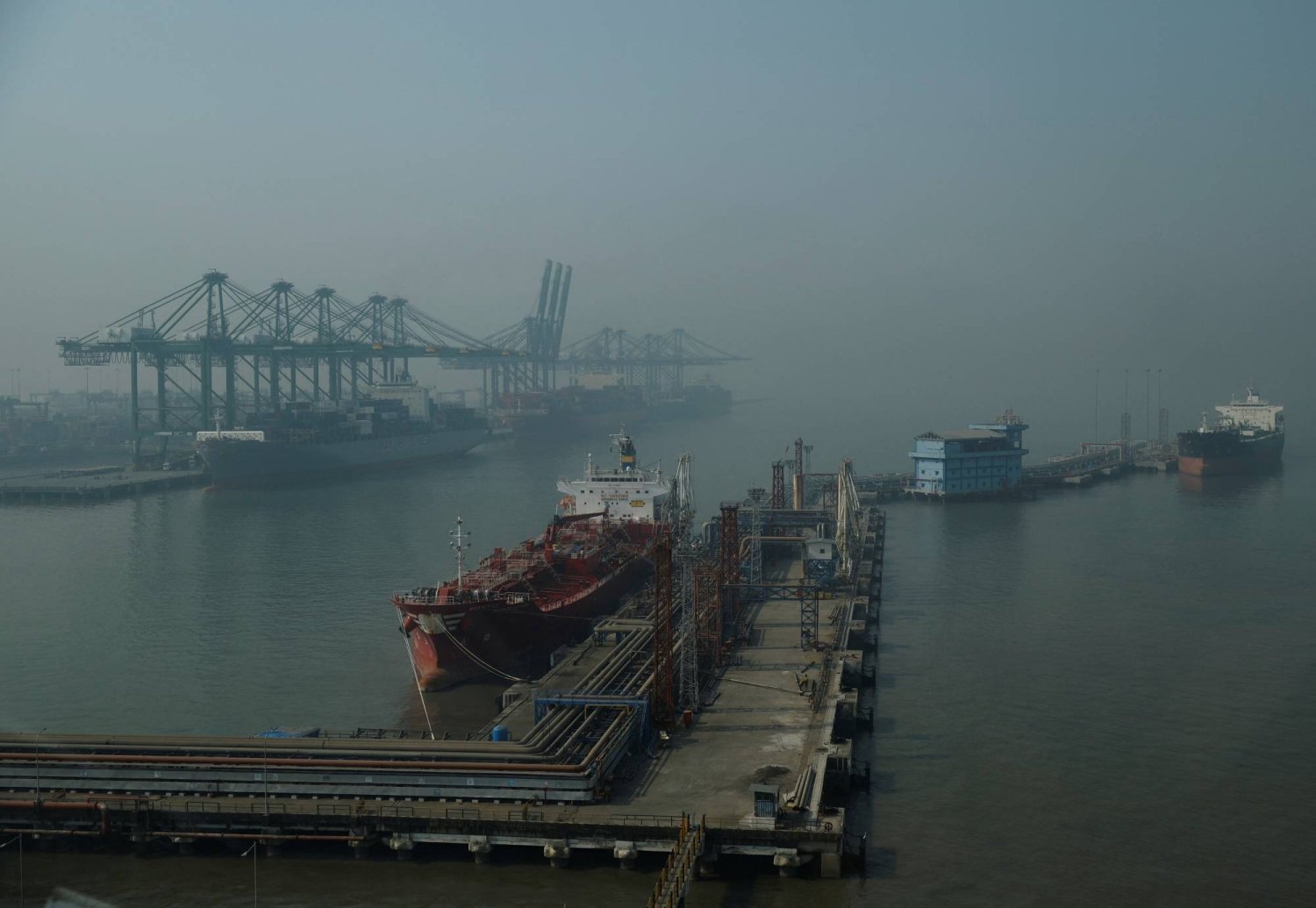 cargo ships are docked at apm terminals, in navi mumbai