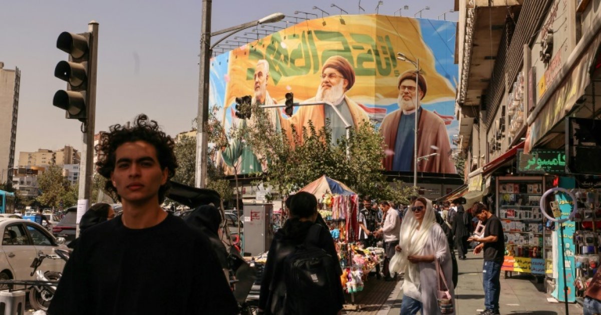 Iran denounces UN sanctions return, rial at historic low