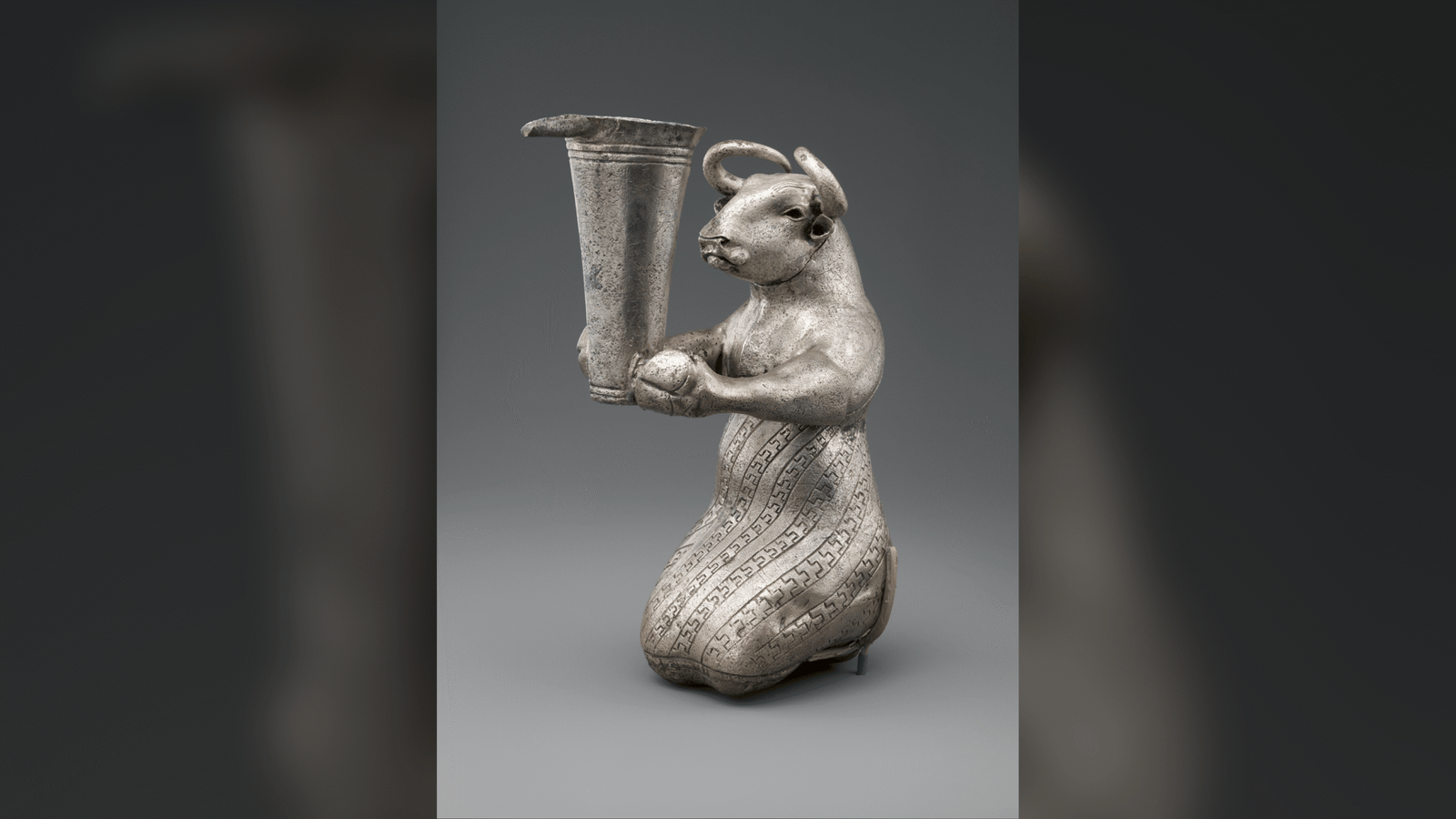 Kneeling Bull: A Remarkable Half-Bull, Half-Human Silver Figurine from Ancient Iran