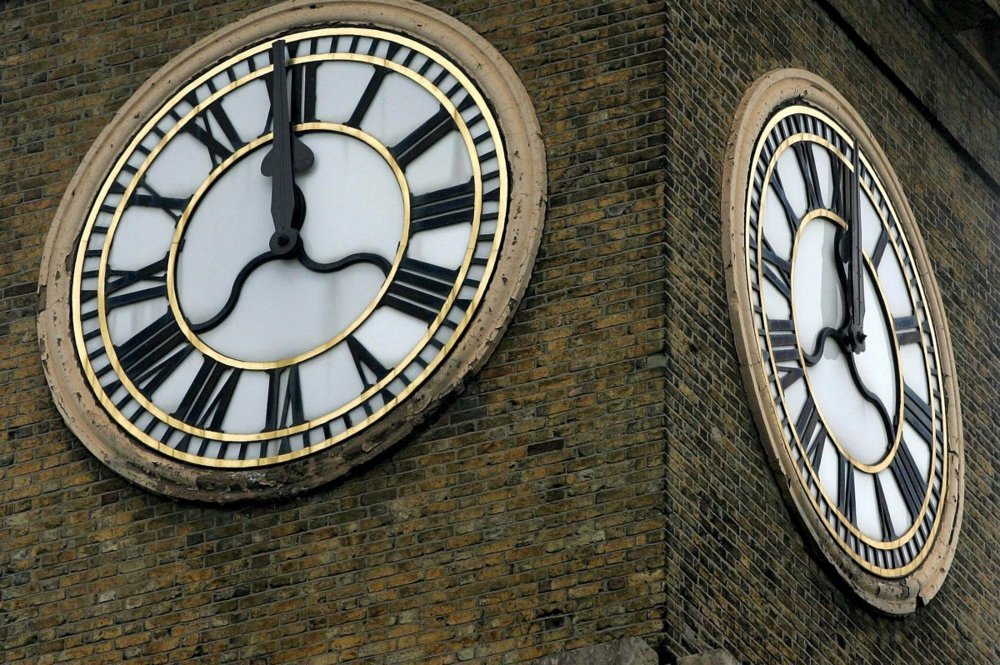 Man Climbs King’s Cross Clock Tower in London with Dog to Protest Iran