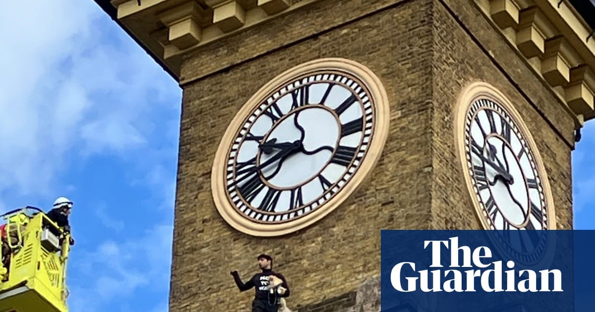 Man Climbs King’s Cross Clock Tower with Dog to Unfurl Iran Protest Banner
