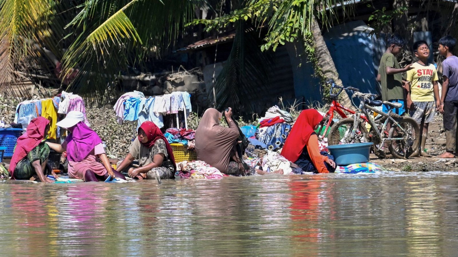 Death toll surpasses 1,000 in devastating floods as military deployed after two storms ravage 4 nations across Asia
